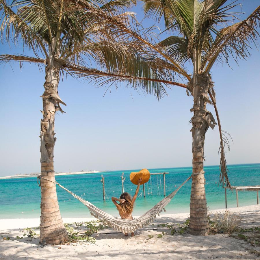 Hotel Nurai Island, Saadiyat Abu Dhabi Exterior foto Hammock on the beach